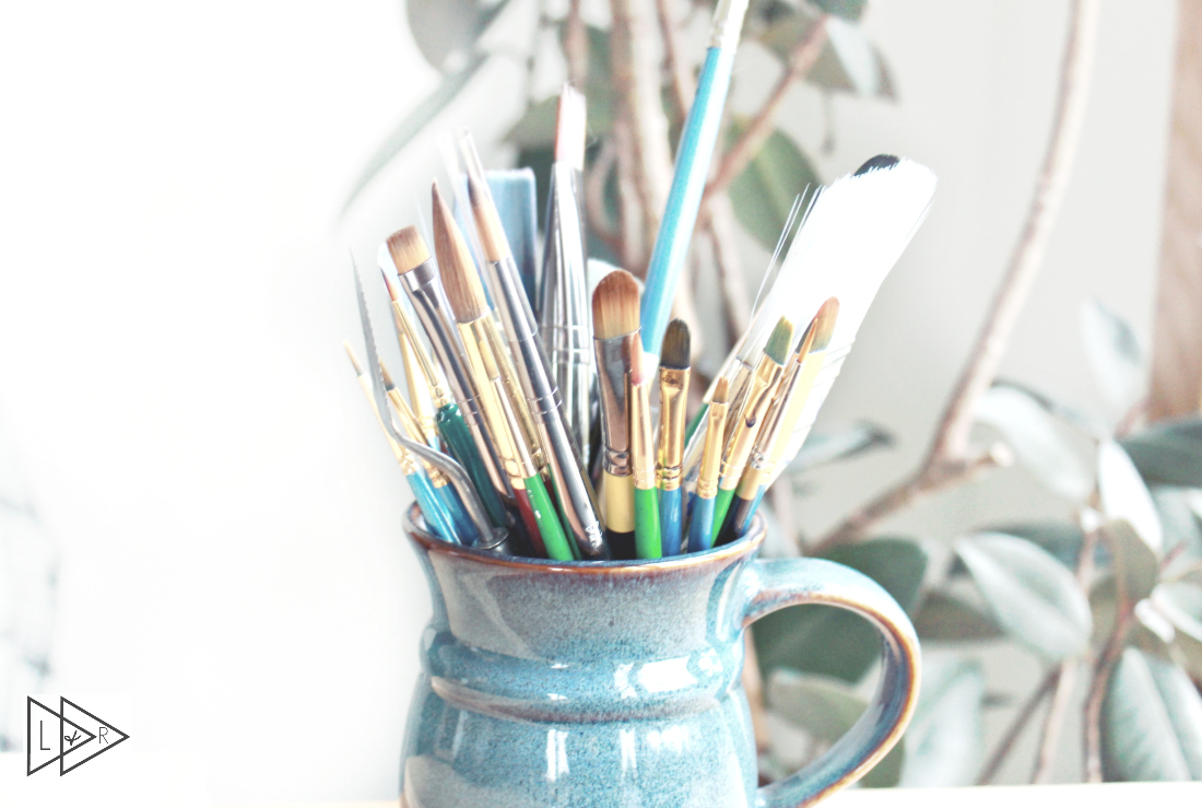 cup of paint brushes
